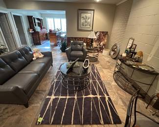 Natuzzi Editions grey leather sofa and chair, matching coffee table, end table and sofa table.