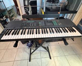 Casio keyboard on stand 
