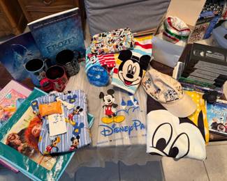 Mickey Mouse is in the house! We have a beautiful Christmas ornament, rain ponchos, bags, pj's and videos