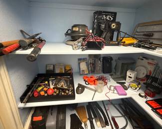Variety of hand tools - knife sharpeners, hand saws, clippers, etc