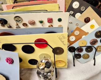 Cardboard sleeves of vintage buttons