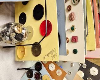 Cardboard sleeves of vintage buttons