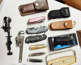 2 tables of tools and related items. Knifes