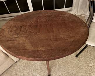 57 110.00 Oval wood table tilt top 31x23x29H