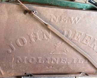 This piece would have been the side hood for the tractor engine off a very early antique John Deere Tractor. The piece features embossed lettering. Very rare early iron piece for the John Deere Collector.  