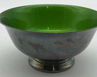 A Reed Barton footed bowl with green enamel interior and silverplate exterior.