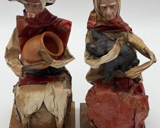 A vintage pair of Mexican paper mache folk art figures.