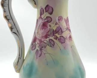 Handpainted Limoges porcelain pitcher with roses and gold trim.
