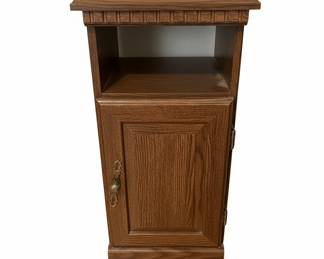 Vintage Oak Nightstand with Paneled Door and Ornate Pull