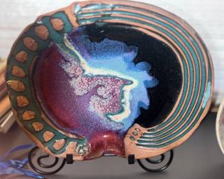 Collection of one of a kind hand thrown designer plates produced in North Dakota
