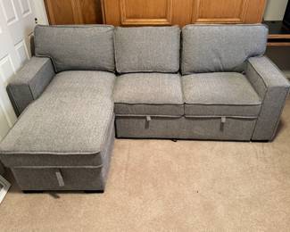 Lounger sofa with storage and pull out bed