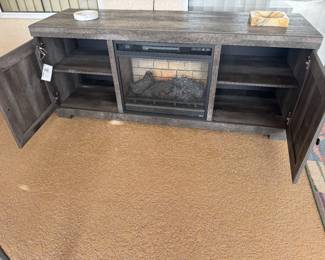 Fireplace with cabinet doors open