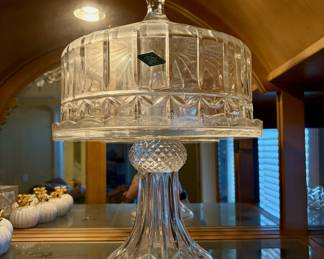 Godinger Olympia 24% lead crystal domed cake plate. 
It is part of the Shannon Collection by Godinger.
The cake stand features a pedestal base and a matching domed lid.
It is a discontinued piece.
The approximate dimensions are 12 inches in width and 17 inches in height.