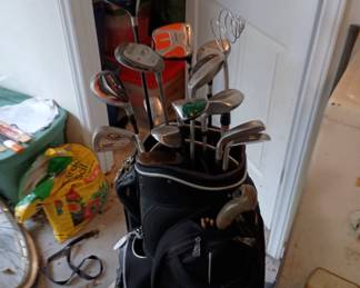 4 vintage golf bags with lots of assorted clubs