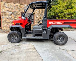 Utility Vehicle with AWD (b).  Large bed for hauling - runs on gasoline.