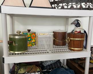 lampshades, above the bed canopy, vintage ice buckets, men's clothing