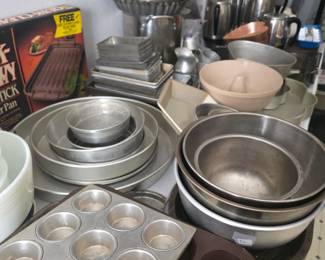 Large table of bakeware.