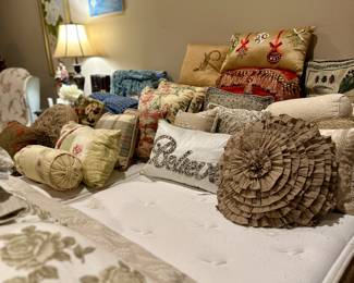 There's a king size adjustable bed hiding under all those pretty pillows