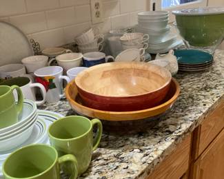 Various dishes and wood salad bowls