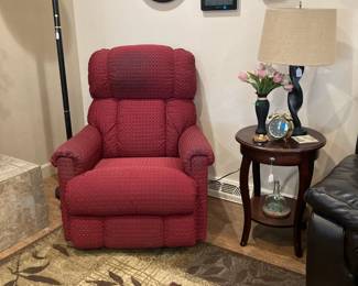 Red Recliner, wall clocks, fun rug, torchiere floor lamp
