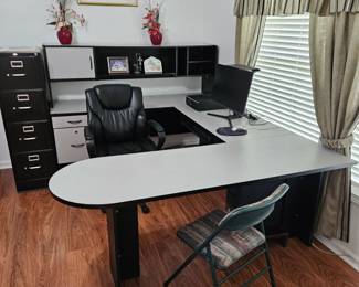 Modular office desk and metal office filing cabinet