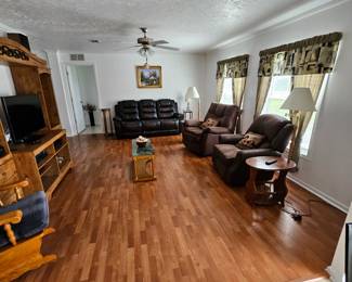 Barely used Leather sofa, Entertainment Center,  wood coffe table, and accessories and wall decor for sale too.