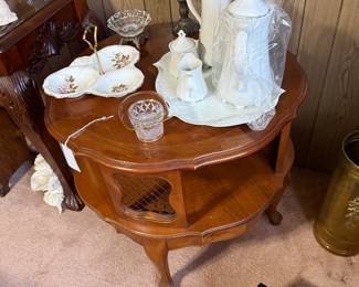 MCM French Provencial round accent table with lower pier, carved apron, and brass mesh panels