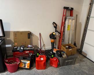 Ladder, some tools, old metal tool boxes, ramp for electric wheel chair, some outdoor gardening items, hose and reels