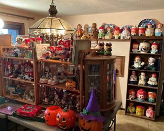 assorted Raggedy Ann and Andy collectibles cookie jars