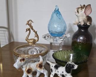 Variety of curios, porcelain figurines, crystal, and more.