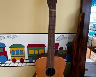 #30	Goldtone kid guitar 29 tall as is needs strings	 $25.00 
