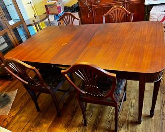 #11	Wood Dining Table w/carved Ends w/1 leaf & 4 Chairs (no captains chairs) - as is finish - 63-72x42x30	 $175.00 
