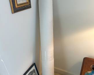 An entire Bolt of The same Fabric as the Dining Room Chairs!!   It was wrapped in Plastis and stored away.   