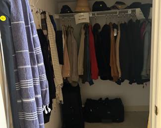 In this Cliset right off the Foyer are multiple Coats, Jackets, Scarves , Unbrellas, Tote Bags  and upscale Luggage.  