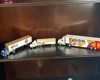 TWO DORITOS AND PEPSI TOY TRUCKS