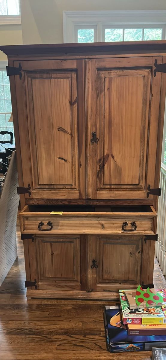 wood wardrobe. Back of upper compartment taken out for stereo cords to pass through