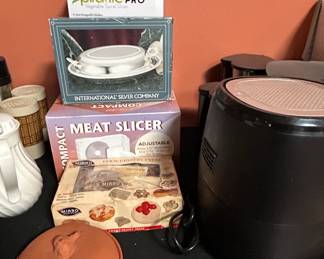 Assorted Kitchen Gadgets Spiralizer, Meat Slicer, and Pastry Press