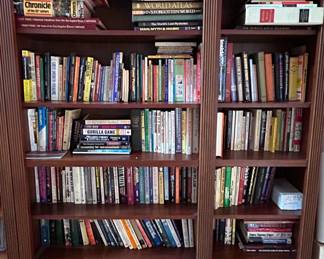 Collection of Books on a Wooden Bookshelf