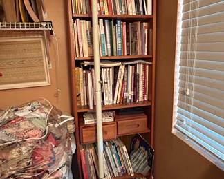 Vintage Bookshelf with Assorted Craft Books and Floor Lamp