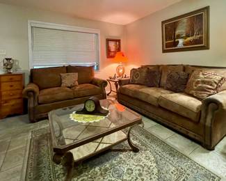 COUCH AND LOVESEAT, METAL/GLASS COFFEE & END TABLES-COFFEE TABLE HAS A CRACK, LAMPS, AREA RUG