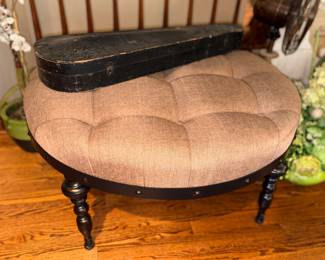 Tufted round ottoman with walnut finish base