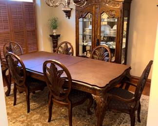 Tuscany carved dining table, 6 chairs, leaves, pads and display cabinet