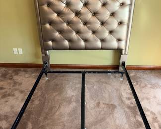 Champagne finished modern tufted headboard with a frame