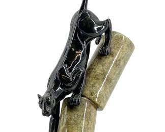 Vintage Black Panther Sculpture on Stone Structure
