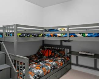 Three way bunk beds steps have storage combined with a built in closet . Even has a built in desk. Includes mattresses. $2,500