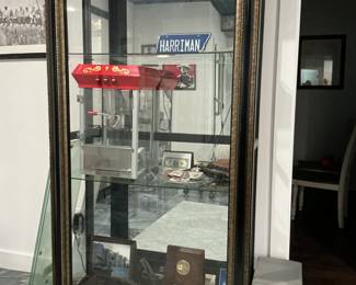 Display cabinet complete with 3/8 tempered glass shelves. Door slides either way 