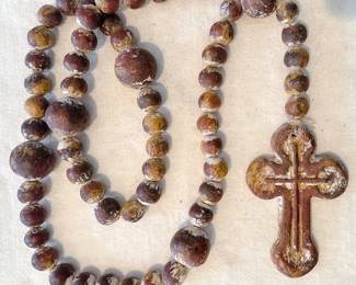 large oversized round wooden rosary beads and cross