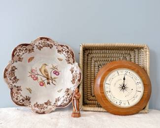 Tide clock by West and Company, quartz. Wooden statue of Saint Joseph by S. Simon with a knife