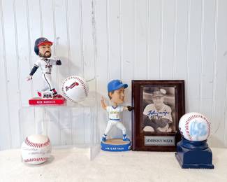 Framed autographed photo display of Jonny Mize. Jim Gatner Milwaukee Brewers Bobblehead. Atlanta Braves Nick Markakis bobblehead. Signed baseballs