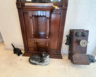 Detailed View of the Cast Iron Hubley Cats, Ornate Carving on the Antique Wall Tree an Western Electric Crank Telephone.